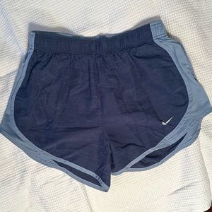 Nike Women’s medium blue running shorts with light blue trim. size S.